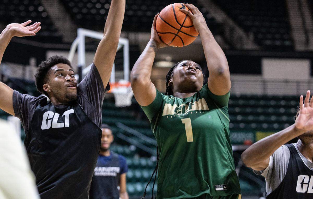 Charlotte 49ers Mya McGraw shoots past a block during practice at the Halton Arena at in Charlotte, N.C., on Wednesday, November 2, 2022.
