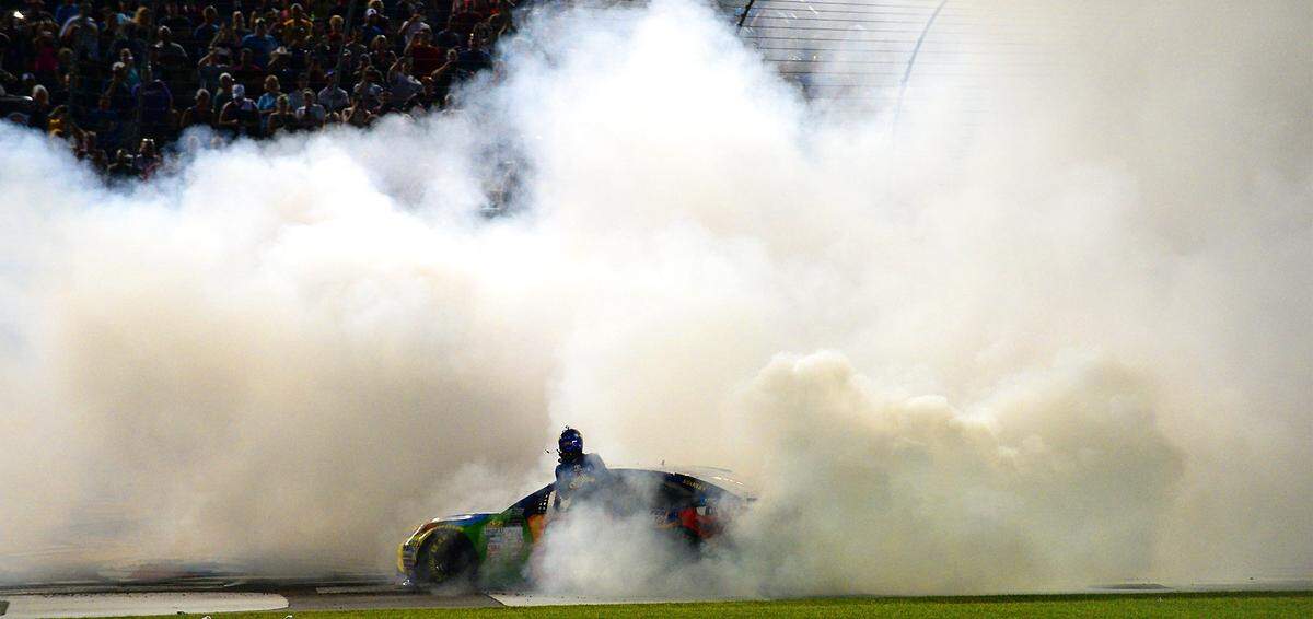 NASCAR driver Kyle Busch exits his car in a haze of smoke after winning the NASCAR Monster Energy All-Star Race on Saturday, May 20, 2017 at Charlotte Motor Speedway in Concord, NC. 