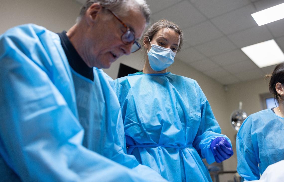 Henry Allison, left and Katie Hopkins work together to dissect a heart at Experience Anatomy.