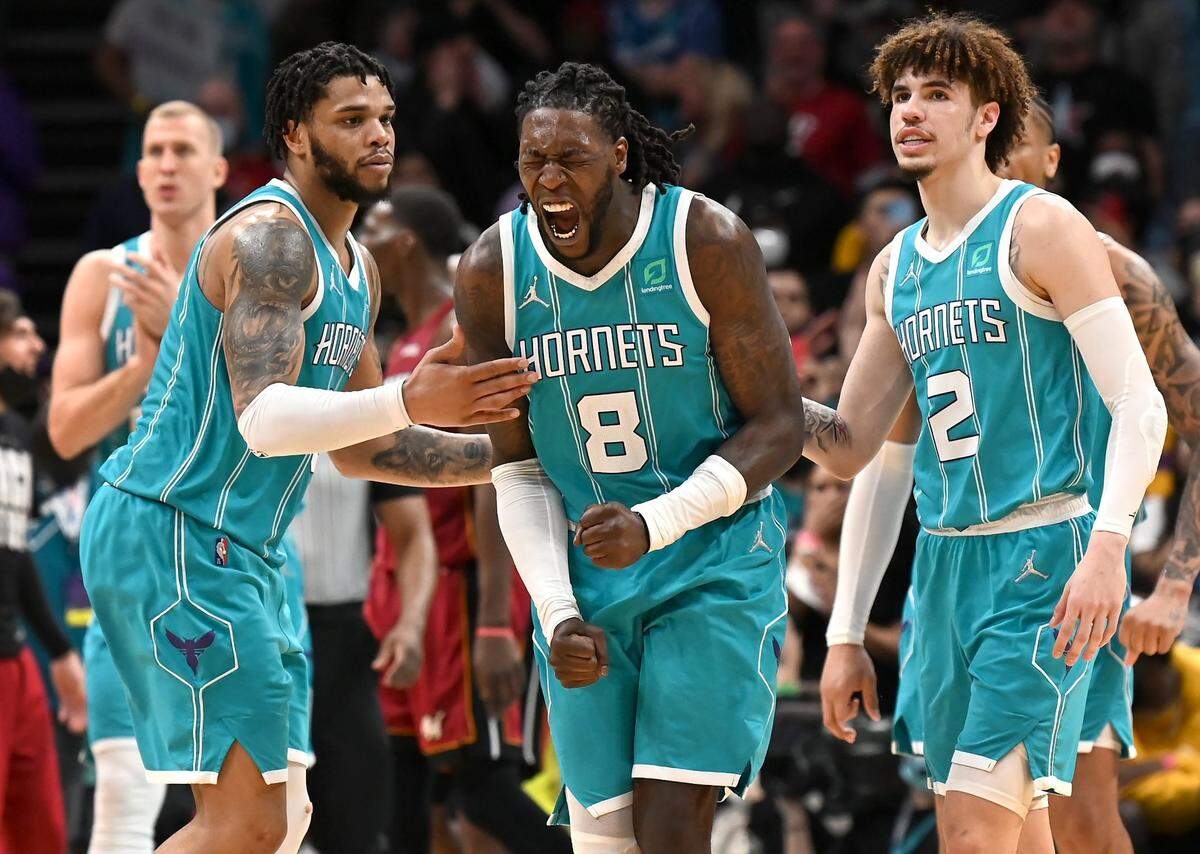 Charlotte Hornets center Montrezl Harrell, center, screams after missing a free throw against Miami Thursday in a 111-107 double overtime loss.