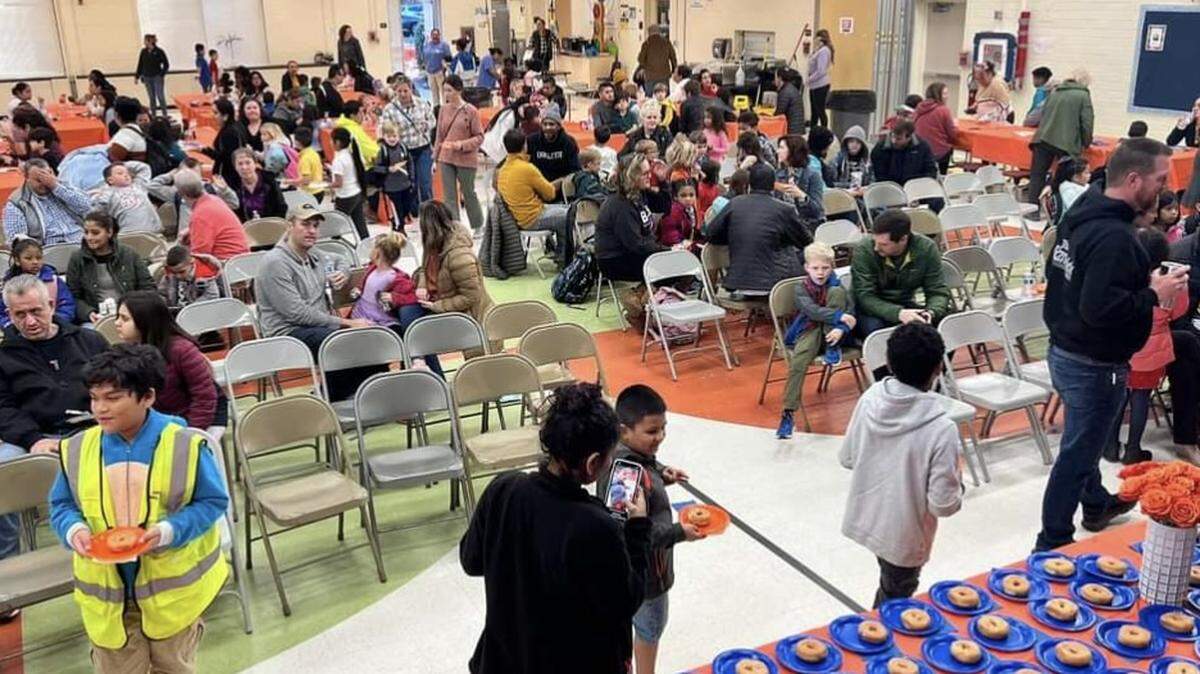 Huntingtowne Farms Elementary’s PTA hosts “Donuts with Dear Ones” in January.