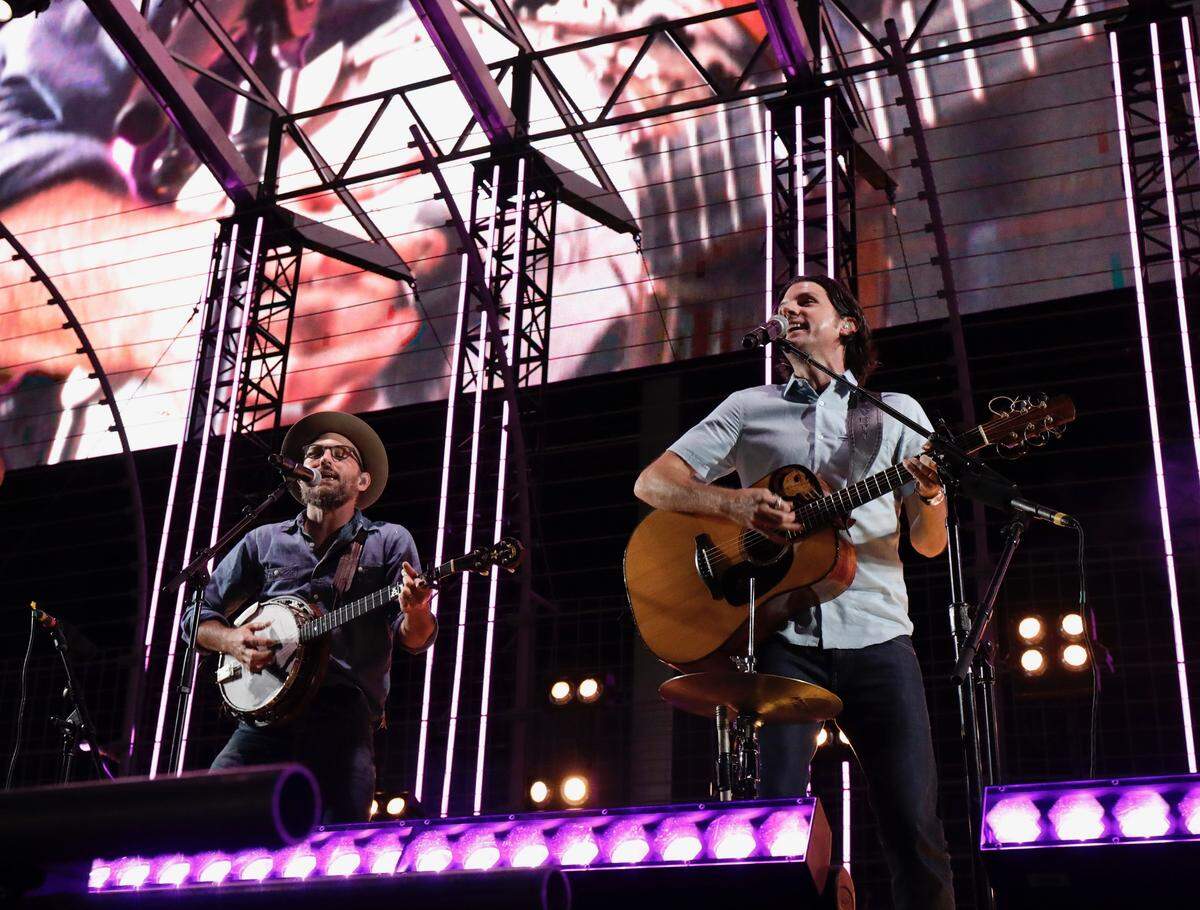 Scott and Seth Avett perform at Charlotte Motor Speedway on Saturday night.