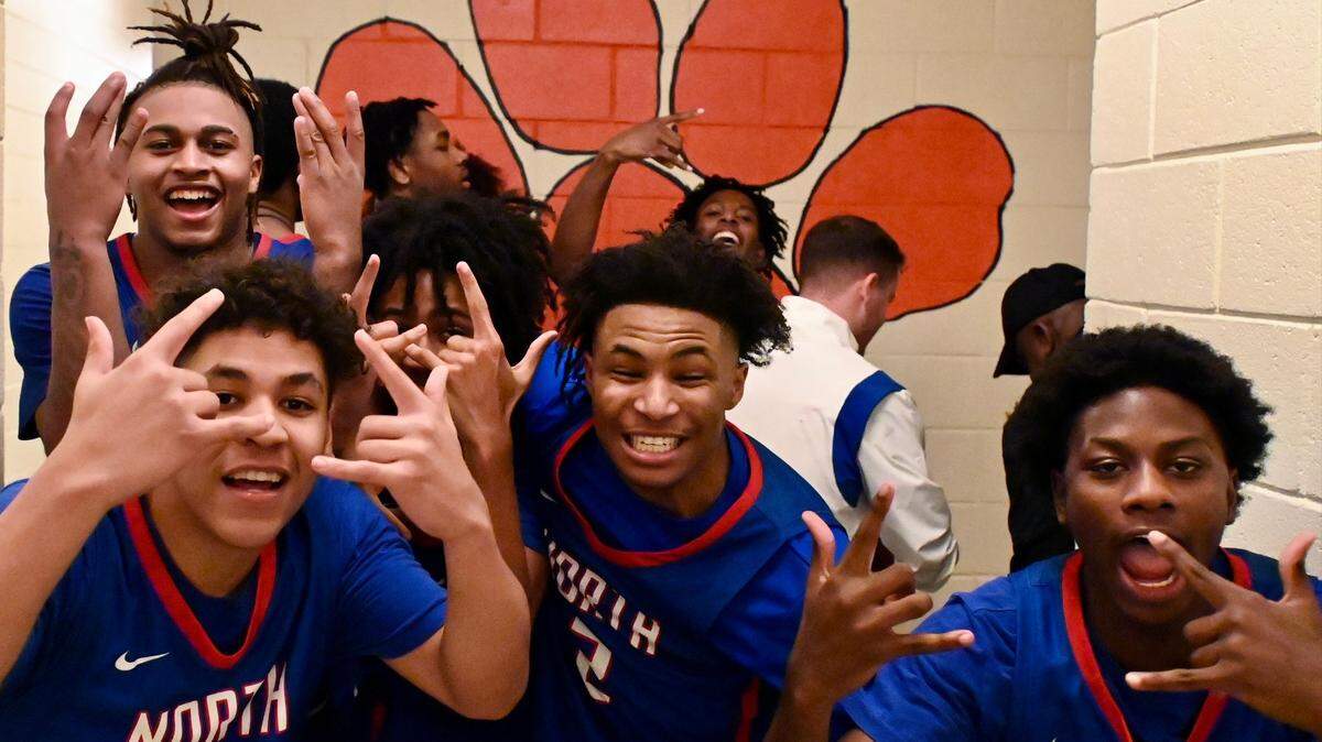 Members of the North Meck basketball team celebrate their 77-74 victory over Chambers High on Friday, January 6, 2023. North Meck won on a basket by Isaiah Evans in the closing seconds of overtime. Jeff Siner/The Charlotte Observer