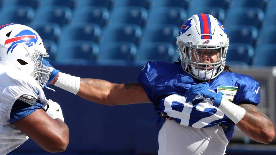Buffalo Bills defensive end Darryl Johnson (92) pass rushes against offensive tackle Bills Daryl Williams (75) in a drill during and NFL football training camp in Orchard Park, N.Y., Thursday, Aug. 20, 2020. (James P. McCoy/The Buffalo News via AP, Pool)