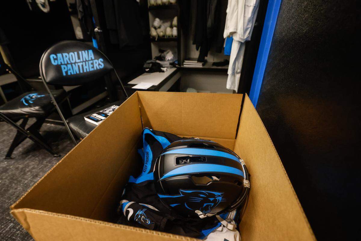 A box in front of Panthers punter Sam Martin’s locker holds a helmet and jersey, among other items, as players clean out their lockers and do exit interviews after their 34-31 loss to the L.A. Rams Sunday.