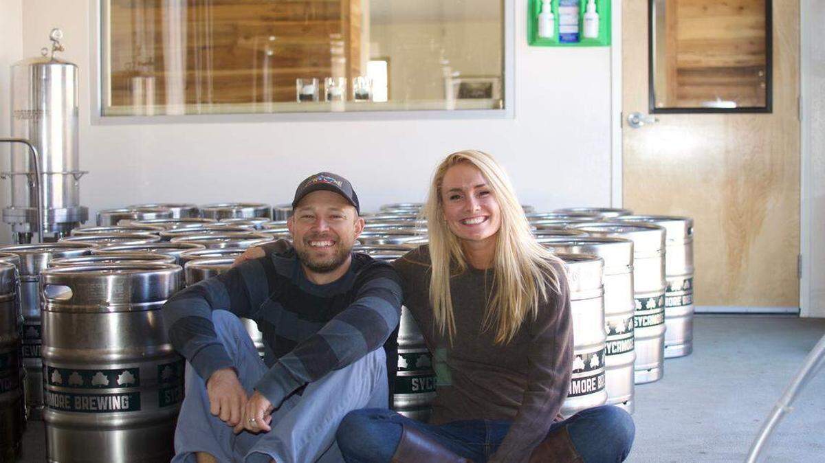 Sycamore Brewing co-owners Justin Brigham and his wife, Sarah Taylor, are shown at the brewery in this Charlotte Observer file photo.
