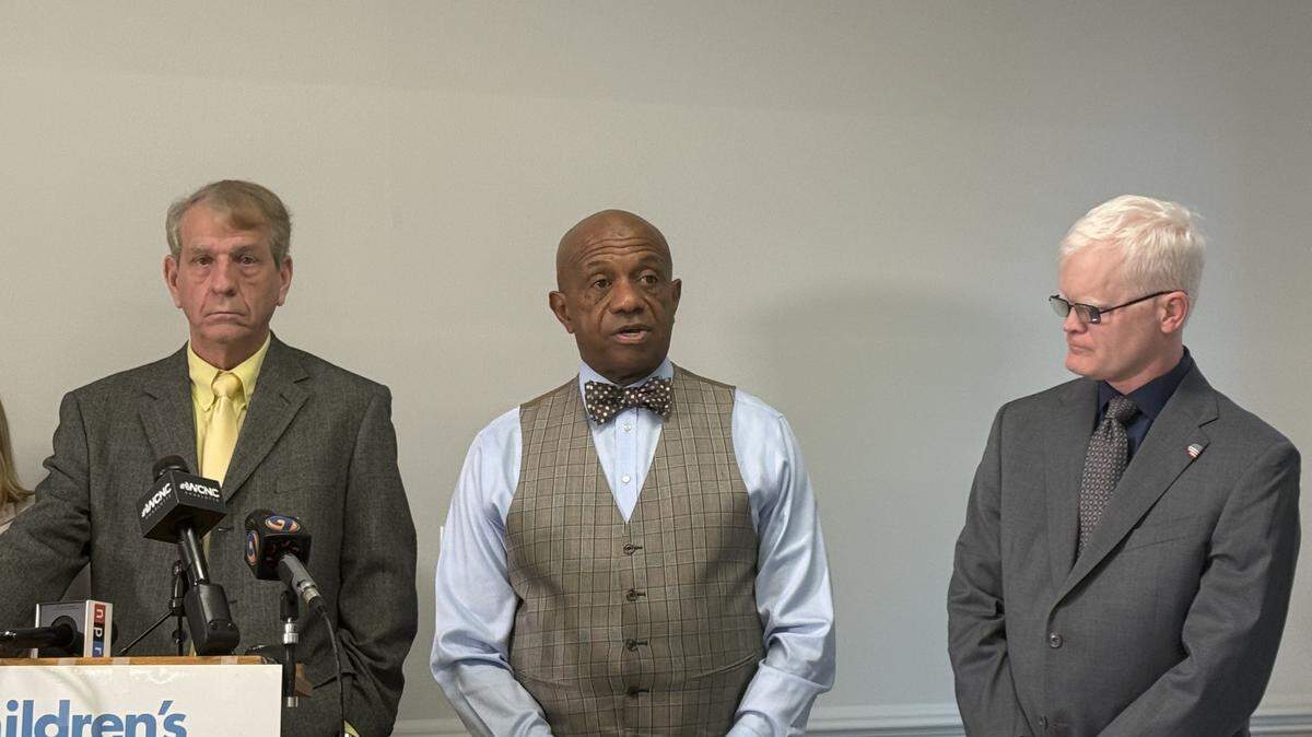 Mecklenburg County Sheriff Garry McFadden talks about reopening Jail North as Children’s Alliance Advocacy Director Frank Crawford, to the left, and state Department of Public Safety Deputy Secretary William Lassiter listen.