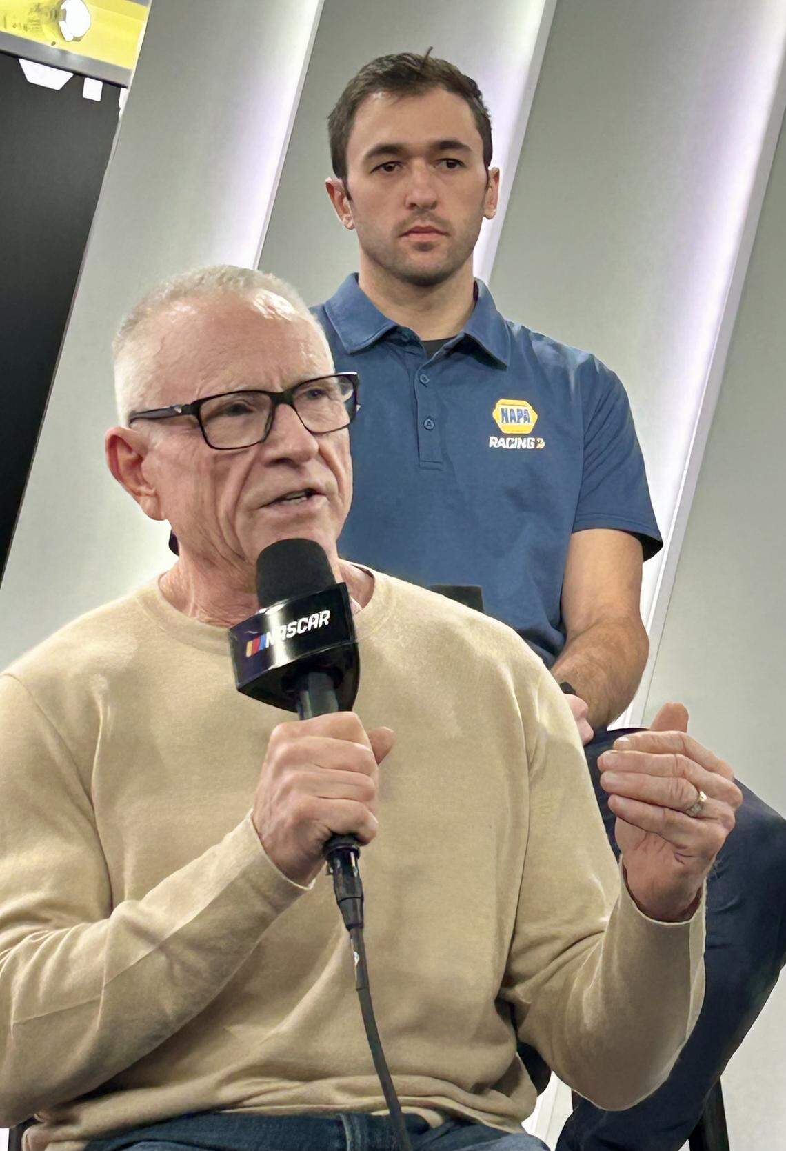 Former NASCAR great Mark Martin speaks as current driver Chase Elliott listens on Jan. 12, 2026, as the sport announces a new playoff format. Martin advocated the old “36-race, no playoffs” system, but says the 10-race playoffs called “The Chase” was “a perfect compromise.”