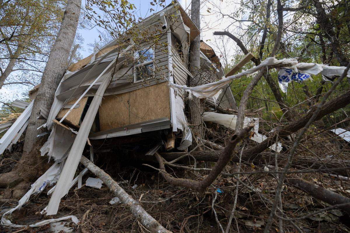 The rushing Broad River rose some 18 feet to Danny Mancini’s modular home, collapsing it and sweeping it off the hill Sept. 28.