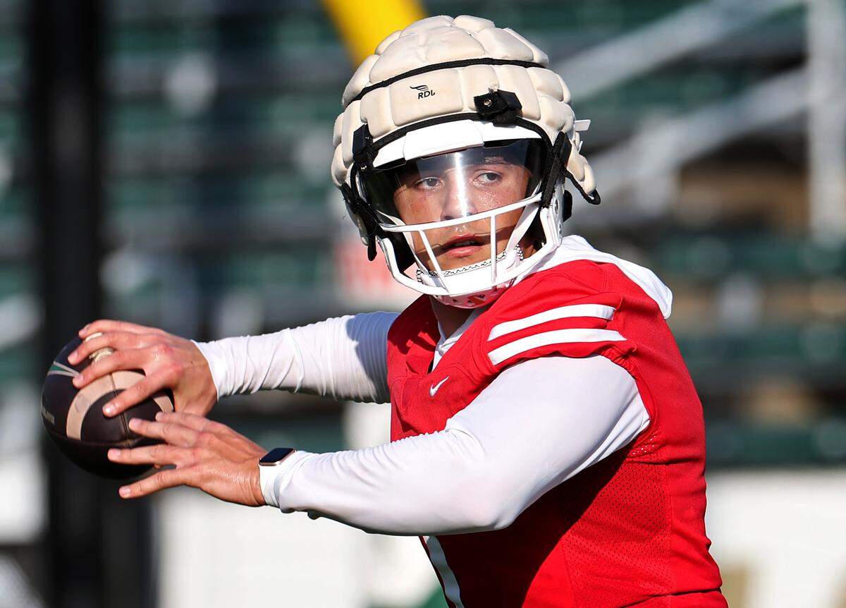 Charlotte 49ers quarterback Max Brown drops back to pass during the team’s first summer training camp practice on Friday, August 3, 2024.