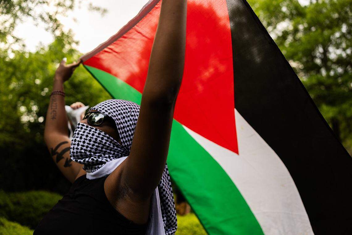 UNC Charlotte students and local activists march through campus during a rally for solidarity with Gaza and to protest student oppression at UNC Charlotte in Charlotte, N.C., on Tuesday, May 7, 2024.