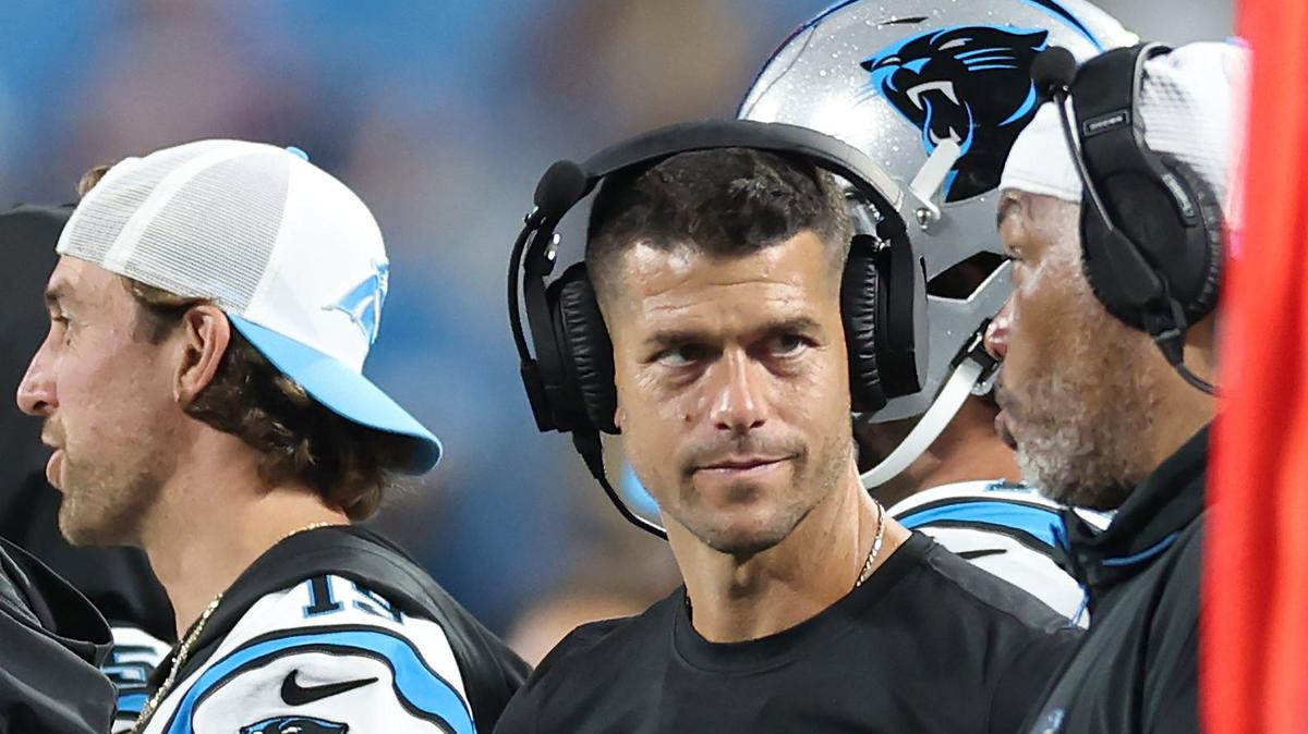 Carolina Panthers head coach Dave Canales, center, talks with an assistant coach along the sidelines during fourth quarter action against the New York Jets at Bank of America Stadium in Charlotte, NC on Saturday, August 17, 2024. The Jets defeated the Panthers 15-12.
