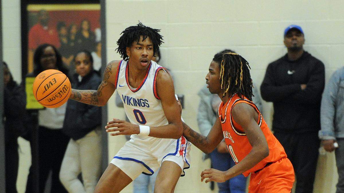 North Mecklenburg’s Isaiah Evans, left,a McDonald’s All-American and Duke recruit, looks for an open teammate while guarded by Chambers High’s Jaydon Terrell, right, during the second quarter of the Queen City 3A/4A tournament championship game Friday, Feb. 23, 2024, at Harding University High School in Charlotte, N.C. (CREDIT: BILL KISER/SPECIAL TO THE OBSERVER)