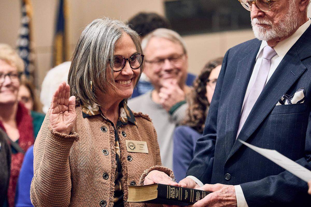 Cynthia Stone, a new board member for Charlotte-Mecklenburg Schools' District 5, is sworn in to her position surrounded by family and friends on December 9, 2025.