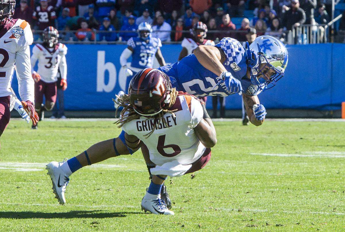 Kentucky’s special teams Zach Johnson tackles Virginia Tech’s Hezekiah Grimsley after catching the ball during the Belk Bowl at the Bank of America Stadium in Charlotte, NC on Tuesday, December 31, 2019.