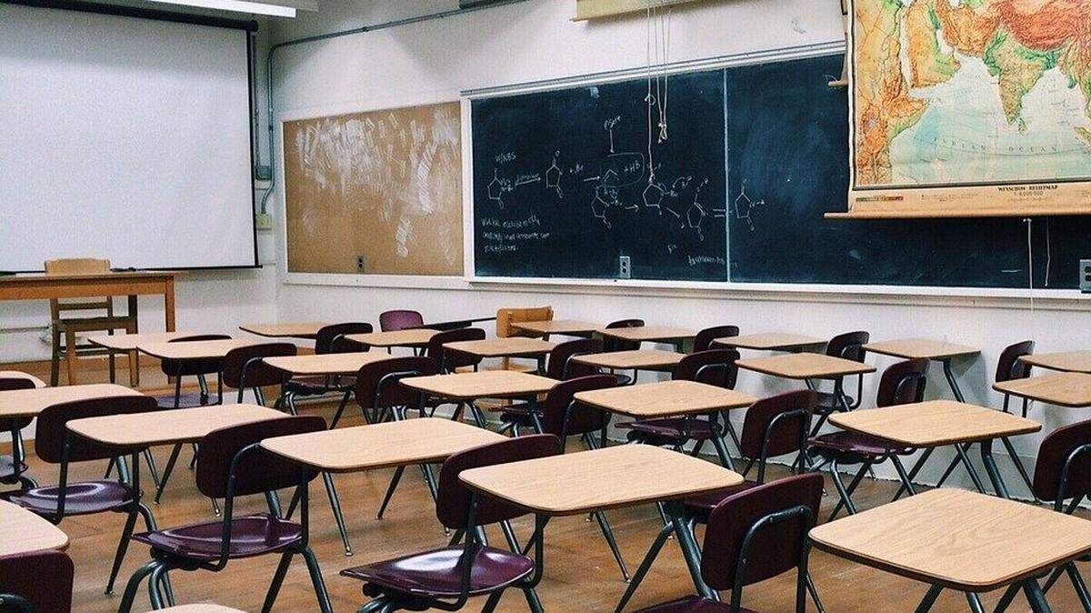 A Iredell-Statesville School District teacher has been suspended and charged with assault following accusations that she put a handicap student in a trash can. 