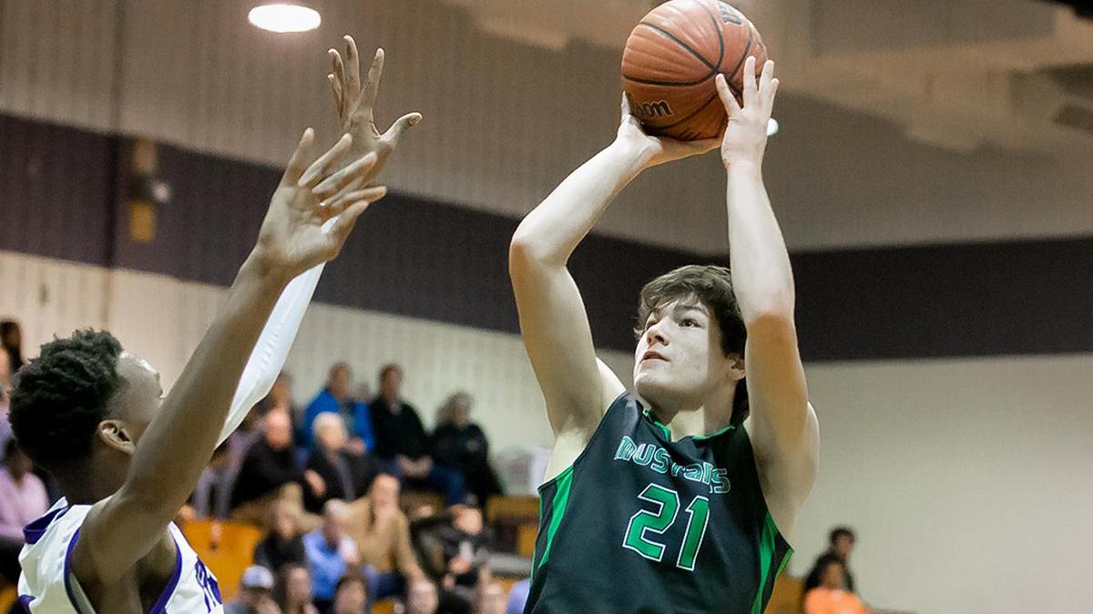 Myers Park Drake Maye (21) knocks down the fade away jumper.