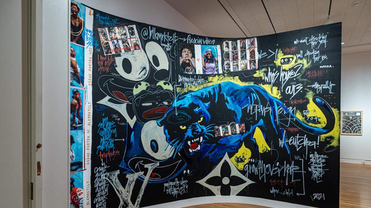 This is the entry wall to the new ‘It Takes a Village’ exhibition at the Mint Museum on Randolph Road. The exhibit features works from Black and other artists of color who are part of three Charlotte art collectives. Artists from BlkMrktClt, a Camp North End-based gallery that supports artists of color, created this work.