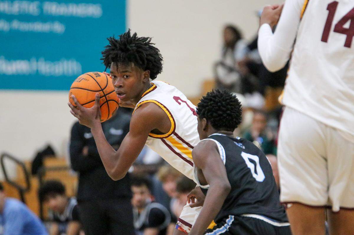 West Charlotte’s Chacho Womack looks for an open teammate during Saturday’s game with Panther Creek at the East West Challenge on December 13, 2025 at Hopewell high school