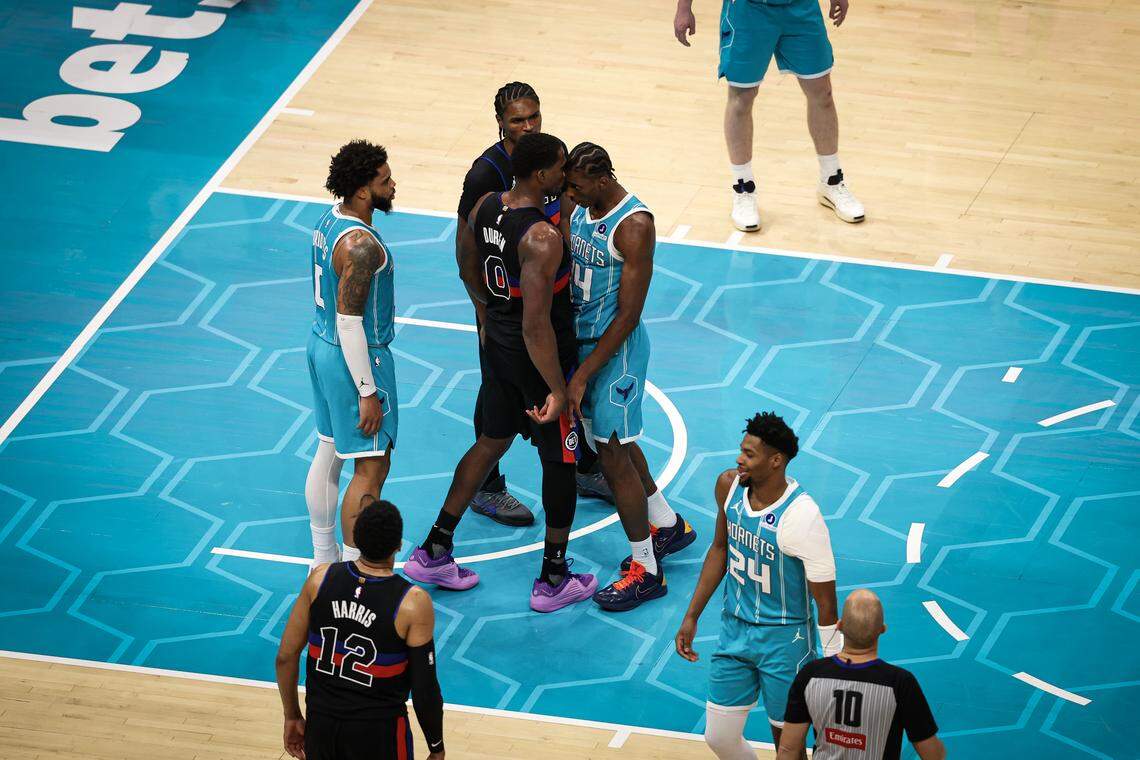 Moussa Diabate (14) of the Charlotte Hornets and Jalen Duren (0) of the Detroit Pistons fight during the second half at Spectrum Center on Feb. 9, 2026 in Charlotte, North Carolina.
