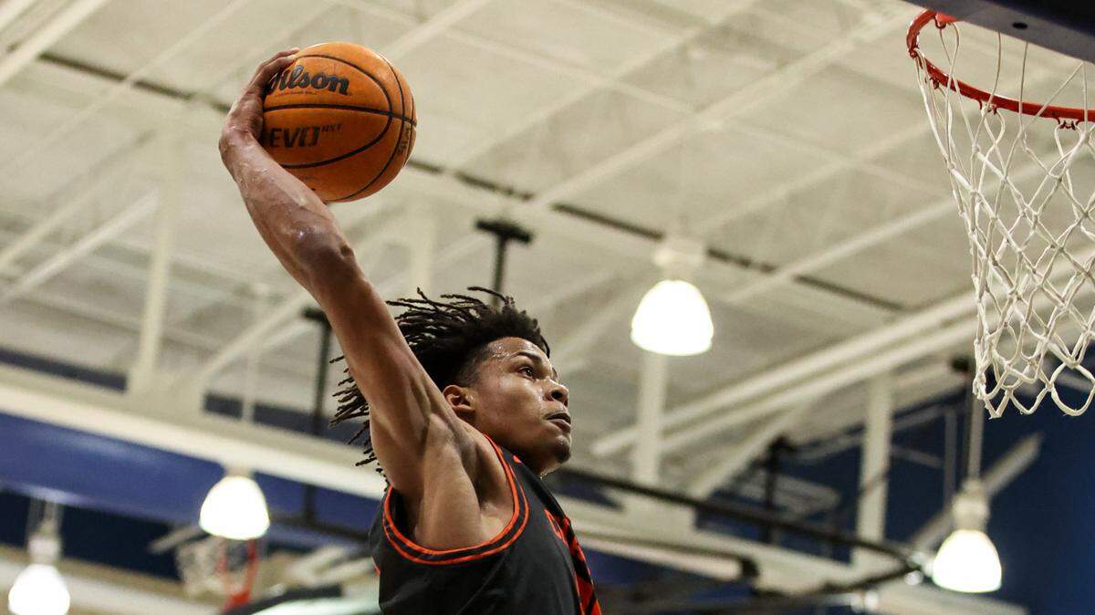 Chambers High Daniel Hankins-Sanford goes up for a dunk against Weddington High during the third round of NCHSAA playoffs on Tuesday, March 1, 2022.