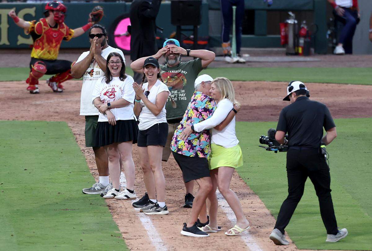 Mike and Deb, a couple who have been married for 44-years defeat other couples in a kiss-off during a break in the action of the Texas Tailgaters vs Firefighters game at Truist Field on Thursday, June 4, 2026.