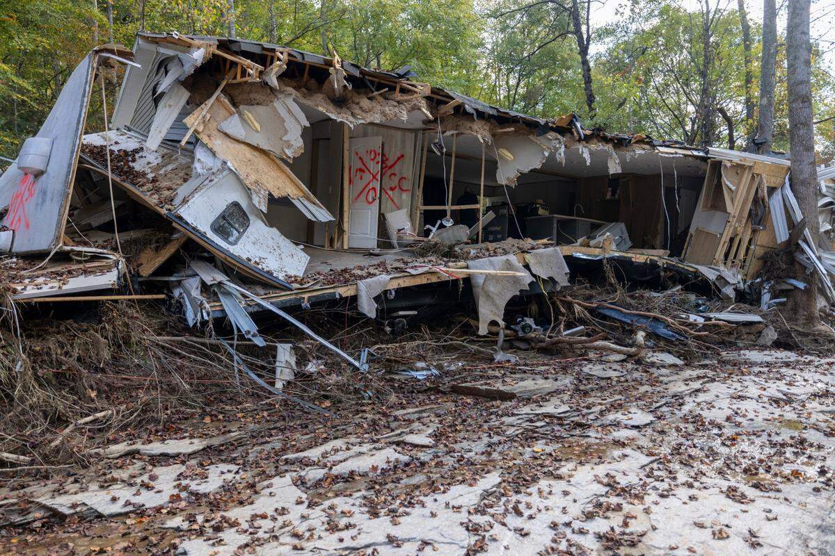 Helene’s floodwaters ripped apart Danny Mancini’s home along the banks of the Broad River in rural Buncombe County. He jumped into the water prior to the home sliding off a hill.