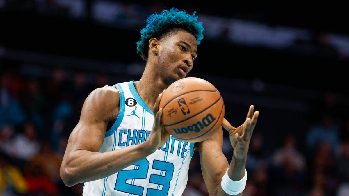 Charlotte Hornets forward Kai Jones passes after pulling in a rebound against the Cleveland Cavaliers during the second half of an NBA basketball game in Charlotte, N.C., Tuesday, March 14, 2023. Cleveland won 120-104. (AP Photo/Nell Redmond)