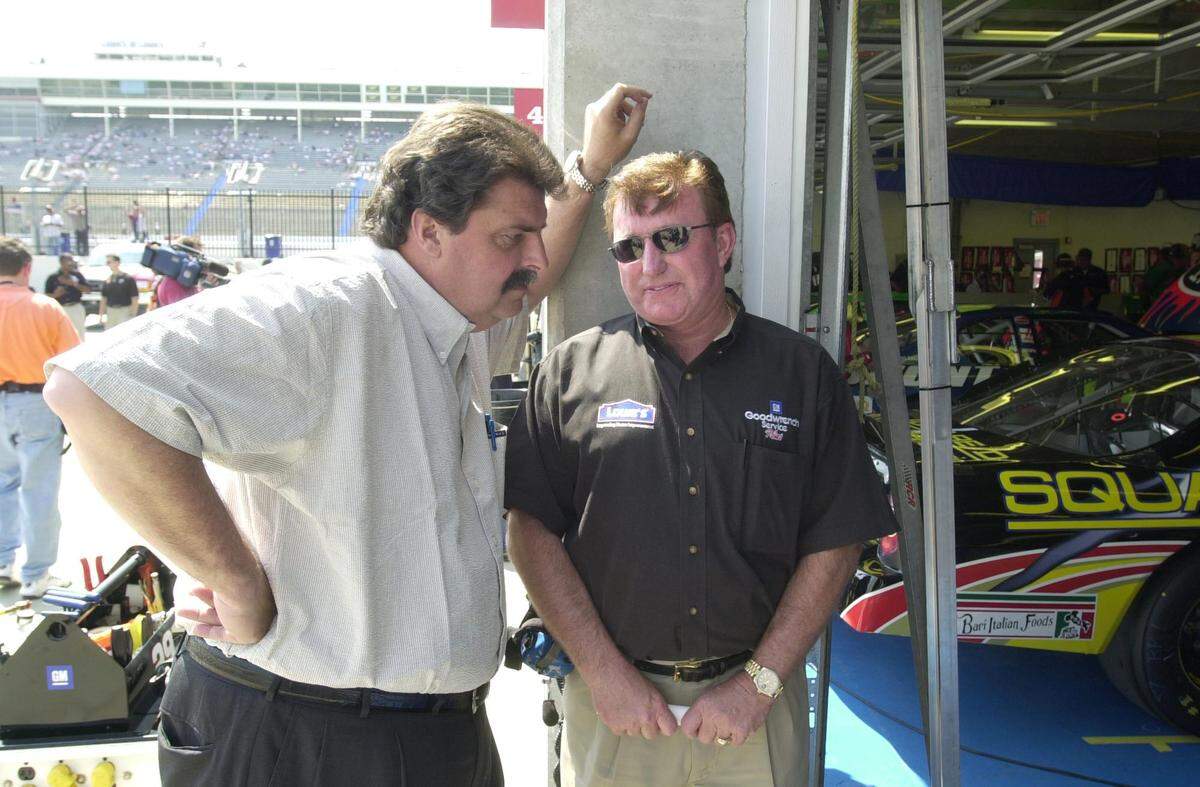 5/18/01 NASCAR President Mike Helton, left, chats with owner Richard Childress Friday at Lowe’s Motor Speedway. CHRISTOPHER A. RECORD/Staff