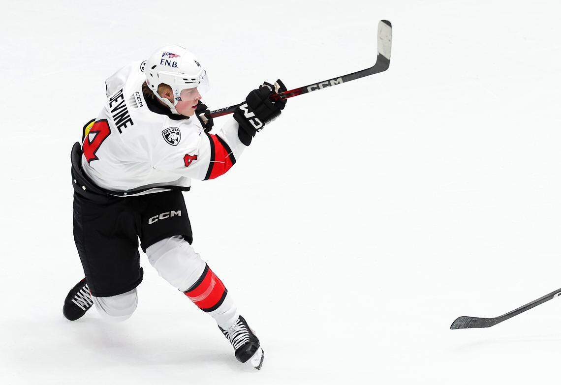 Charlotte Checkers Jack Devine follows through on his shot on goal during second period action against the Iowa Wild on Friday, October 17, 2025 at Bojangles Coliseum in Charlotte, NC. Devine scored on the play. 