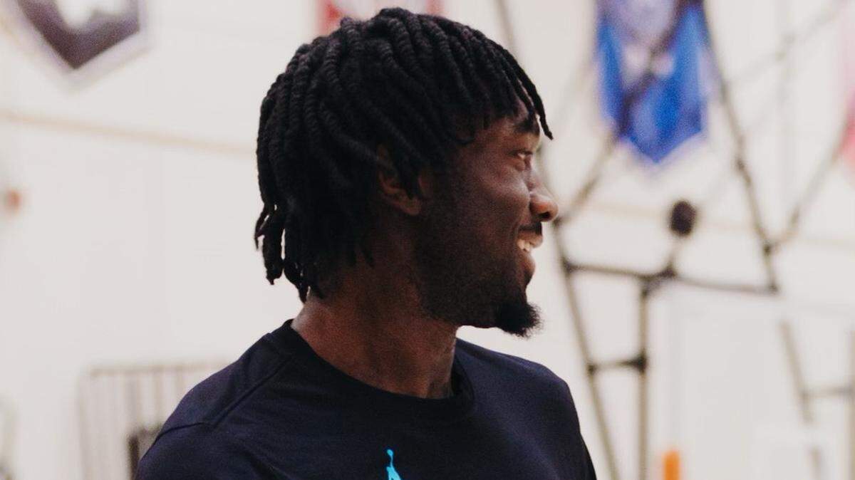 Charlotte Hornets center Mark Williams is all smiles following a workout.