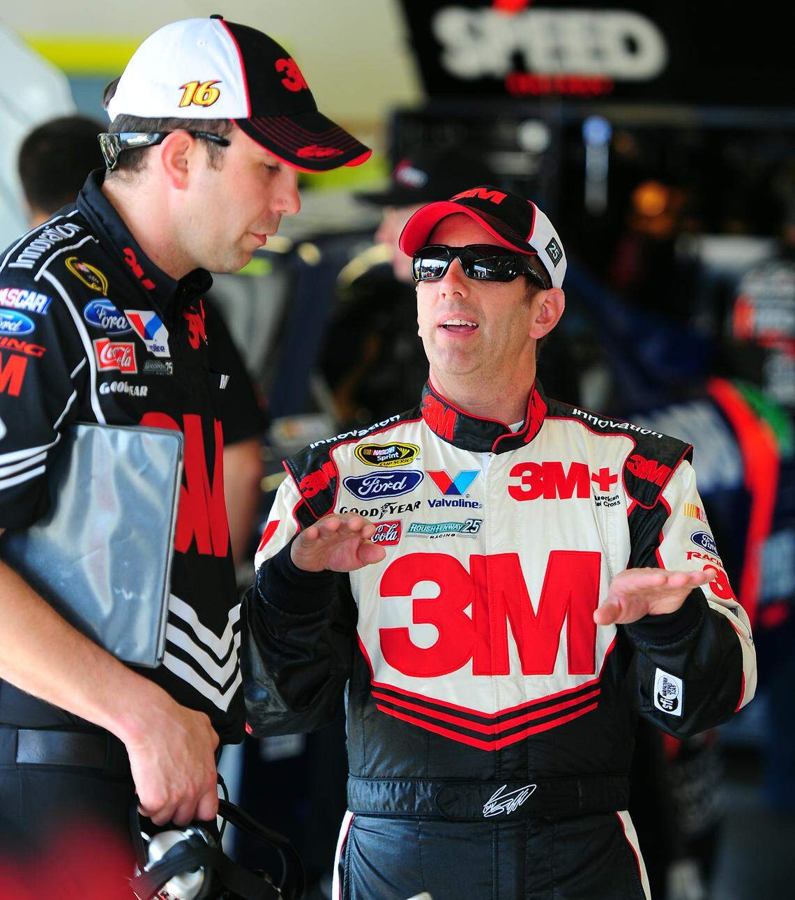 NASCAR star Greg Biffle, right, seen here in a 2012 file photo with a crew member during a break in practice at Daytona International Speedway, died Dec. 18 after his plane crashed at Statesville Regional Airport.