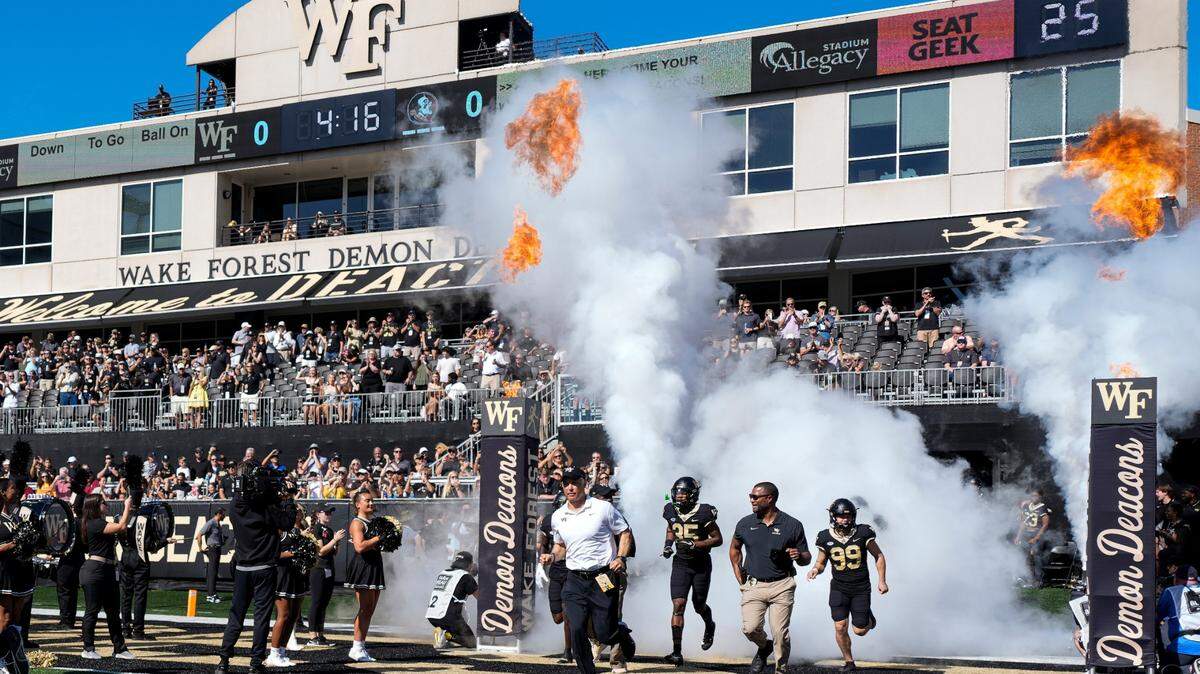 Oct 28, 2023; Winston-Salem, North Carolina, USA; Wake Forest Demon Deacons head coach Dave Clawson takes the field with his team during the first half against the Florida State Seminoles at Allegacy Federal Credit Union Stadium.