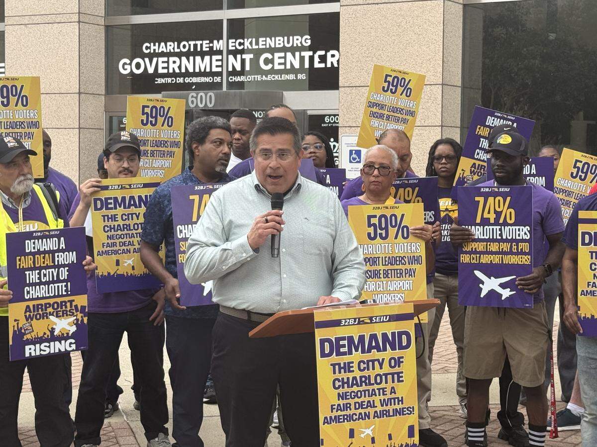 Enrique Lopezlira, director of low-wage work program at University of California, Berkley, speaks at a press conference with Charlotte airport workers on Tuesday, May 26, 2026.