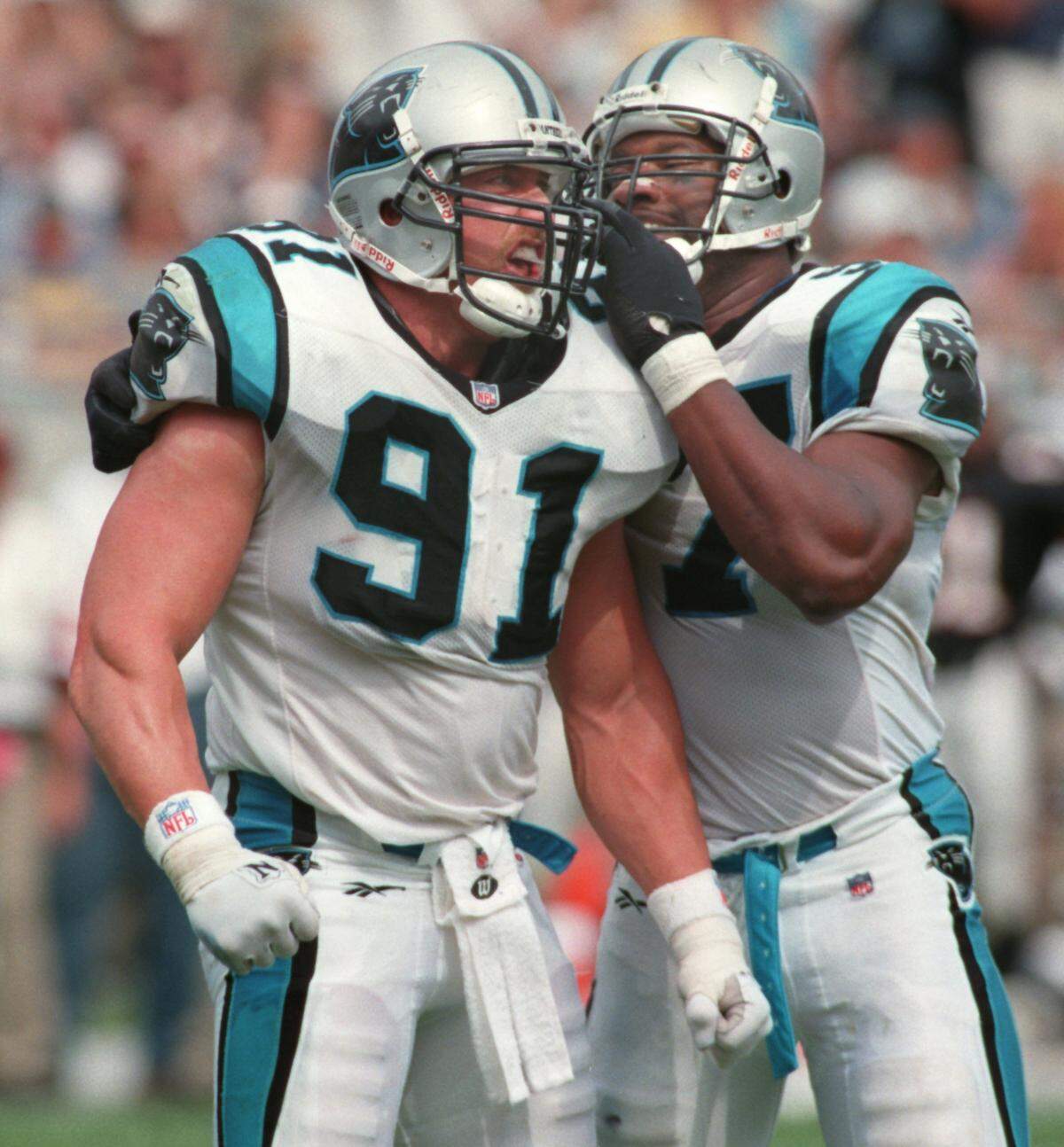 9/06/96 1B BOB LEVERONE/Staff Panthers linebackers Kevin Greene (91) and Lamar Lathon combined for five sacks in Sunday’s opener against Atlanta. Lathon leads the league in sacks with three. (UNPUBLISHED NOTES:) (CHANDLER 9/1/96) Panther linebackers Kevin Greene(91) and Lamar Lathon(57) are cut from the same mold. Here they both celebrate one Greene’s two sacks against Atlanta. photo by bob leverone