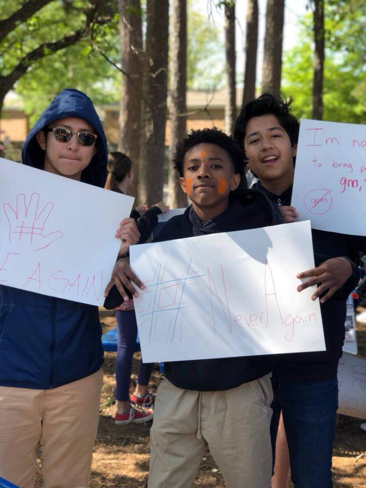 Collinswood Language Academy students display signs made for the April 20 National School Walkout event.