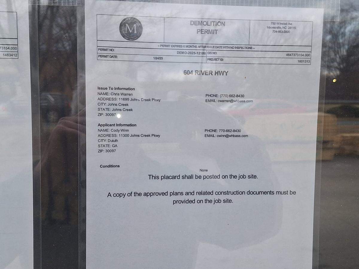 A demolition permit is posted on a door of a planned Whataburger at 604 River Highway in Mooresville near Lake Norman.