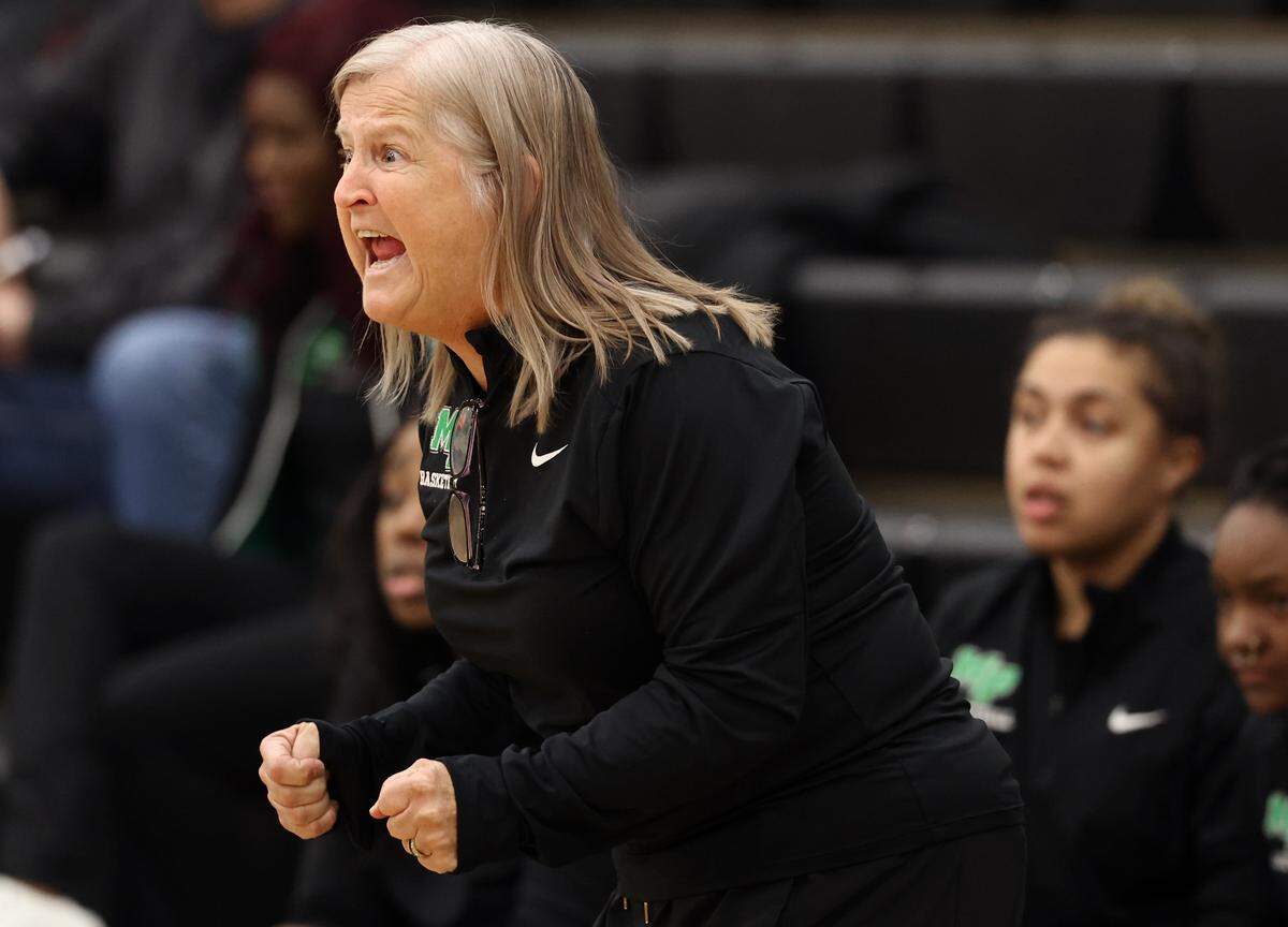 Myers Park girls basketball coach Barbara Nelson yells instructions to her team during half action against South Meck on Friday, January 17, 2025 at Myers Park High in Charlotte, NC.