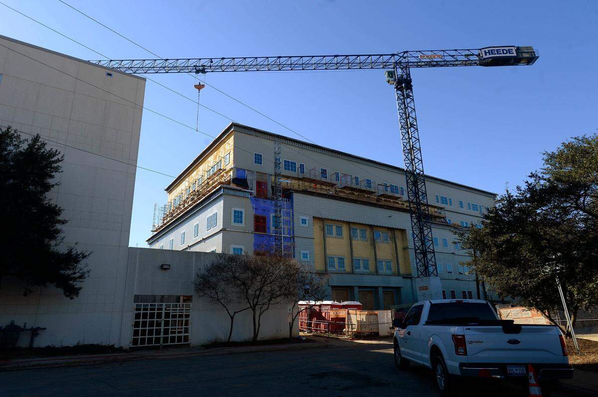 A construction crane towers over a building on the campus at Central Piedmont Community College’s Central Campus on Tuesday, January 22, 2019.