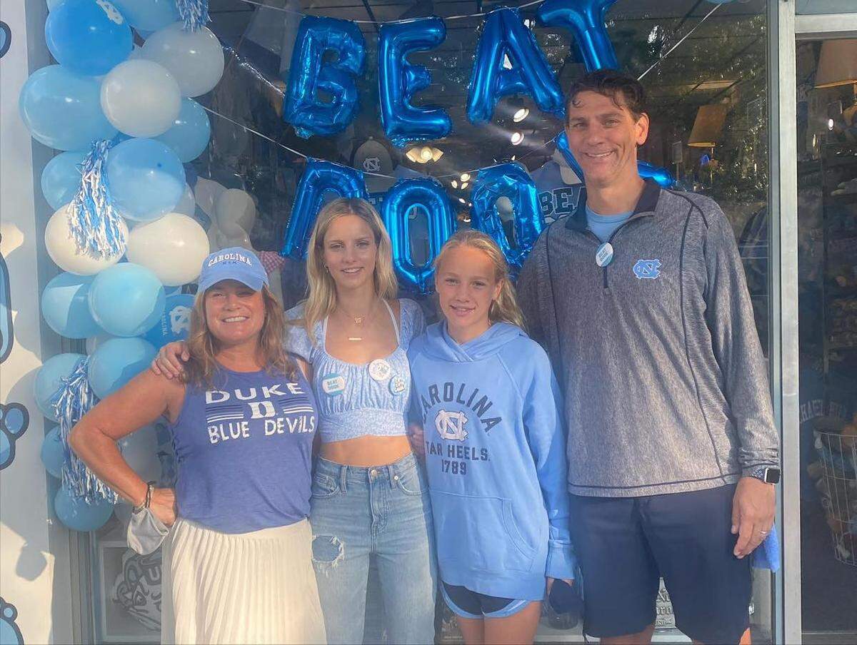 From left to right: Duke fan April Whitlock, oldest daughter Camden (a UNC freshman), youngest daughter Cailin (who apparently sides with her big sister), and Carolina fan Thomas Whitlock.