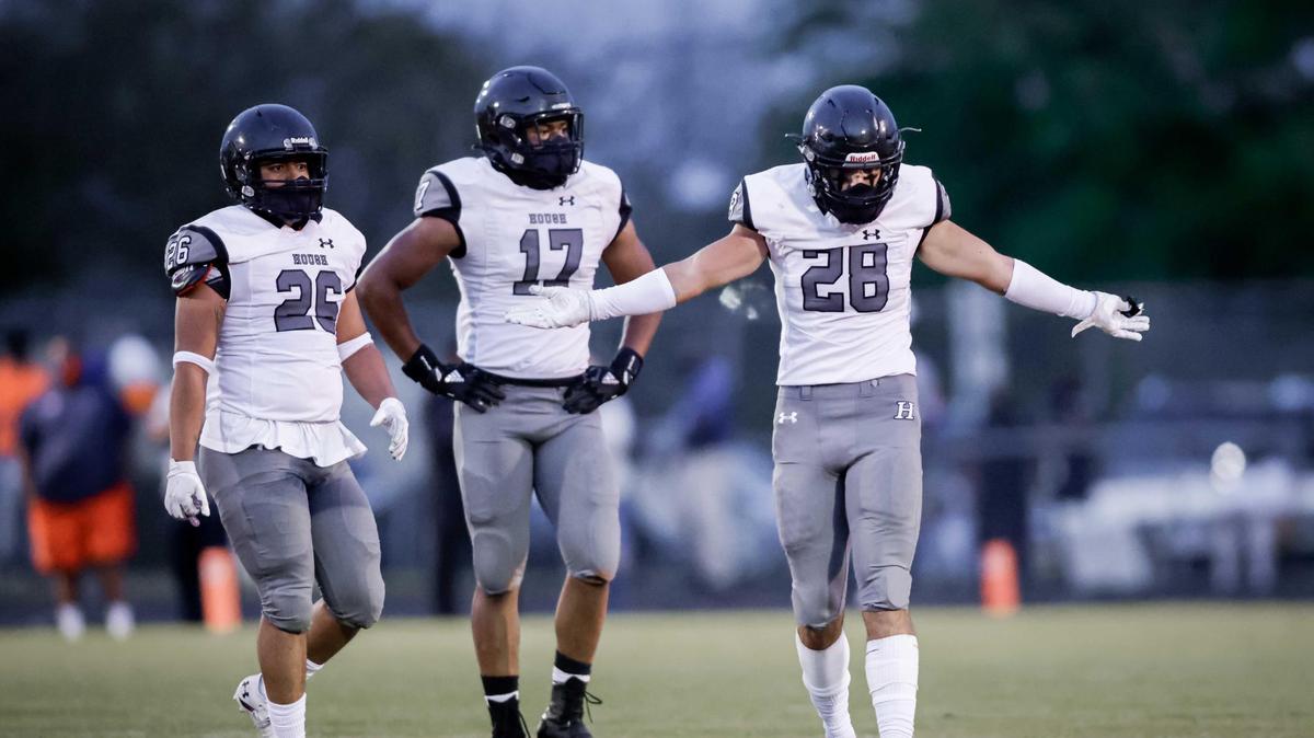 Hough Huskie Grant Pallo (28) celebrates hisinterception. Hough Huskie Jacquon Gibson (10) catches the deep pass for the 1st down. The Hough Huskies win the I-MECK 4A championship 29-22 vs the Vance Cougars Friday April 9, 2021.