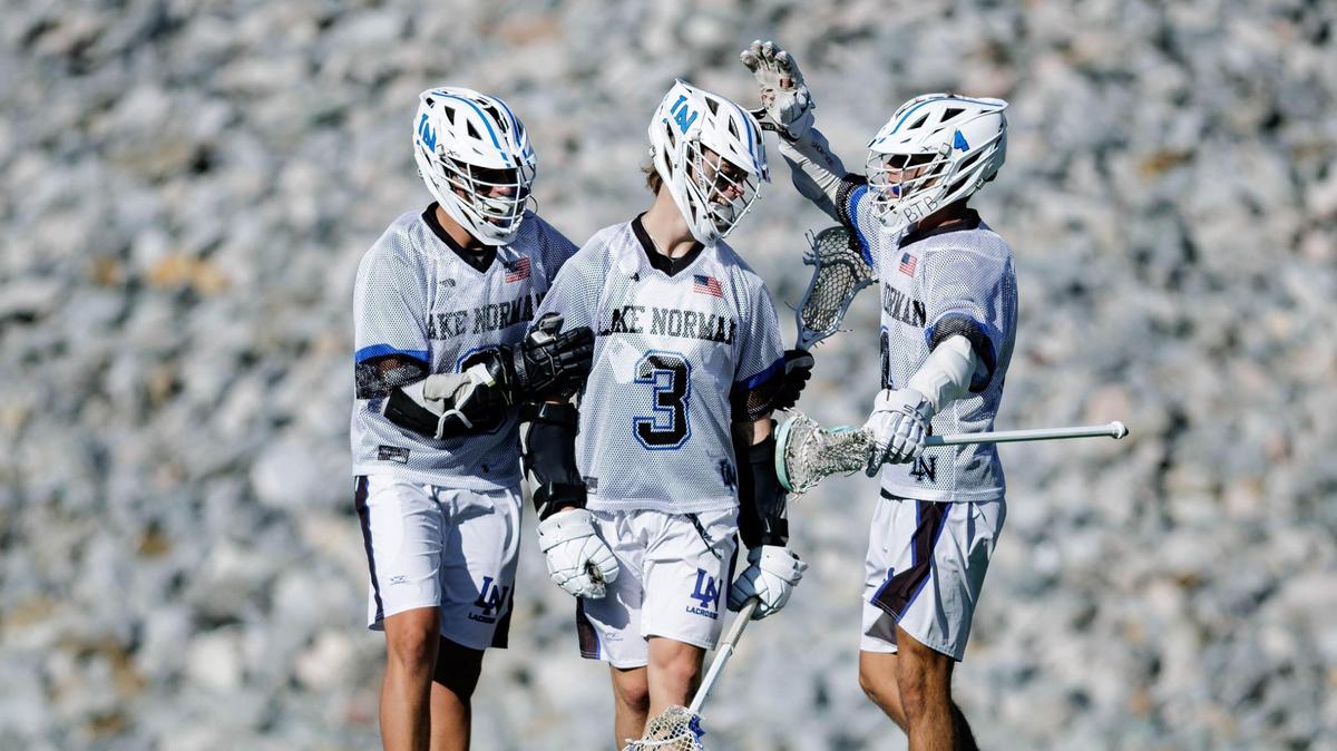 Lake Norman’s Cannon Wigginton (3) celebrates with his teammates his 3rd period goal. Lake Norman would host Charlotte Catholic in the NCHSAA boys lacrosse match May 20, 2025.