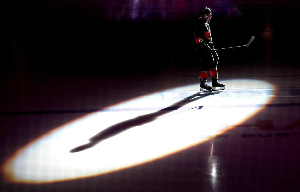 Charlotte Checkers left wing John Leonard shadow is cast across the ice as he is introduced to the opening night crowd at Bojangles Coliseum in Charlotte, NC on Friday, October 18, 2024. The Checkers hosted the Cleveland Monsters.