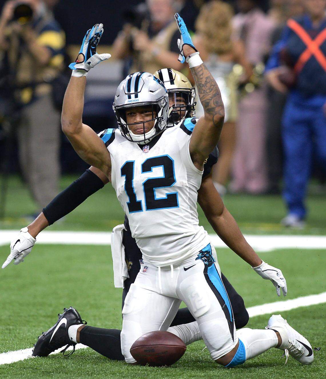 Carolina Panthers wide receiver DJ Moore signals to an official a touchdown after he dove toward the end zone following a pass reception from quarterback Kyle Allen during first quarter action against the New Orleans Saints at the Mercedes-Benz Superdome in New Orleans, LA. on Sunday, December 30, 2018. Saints safety Marcus Williams, back, made the tackle. After review, Moore was not credited with a touchdown reception.
