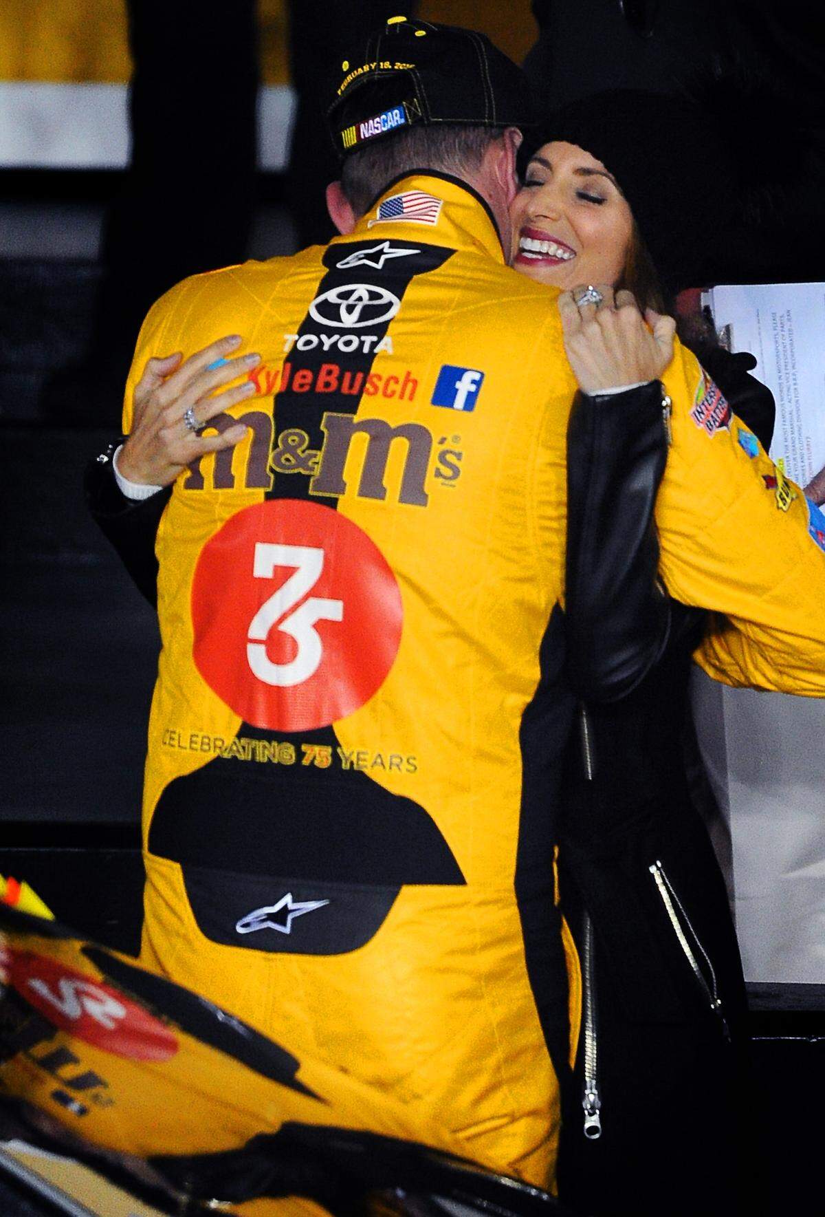 NASCAR Sprint Cup Series driver Kyle Busch hugs his wife Samantha after he won the second can-am duel qualifying race at Daytona International Speedway on Thursday, February 18, 2016. Busch held off driver Jamie McMurray for the victory.