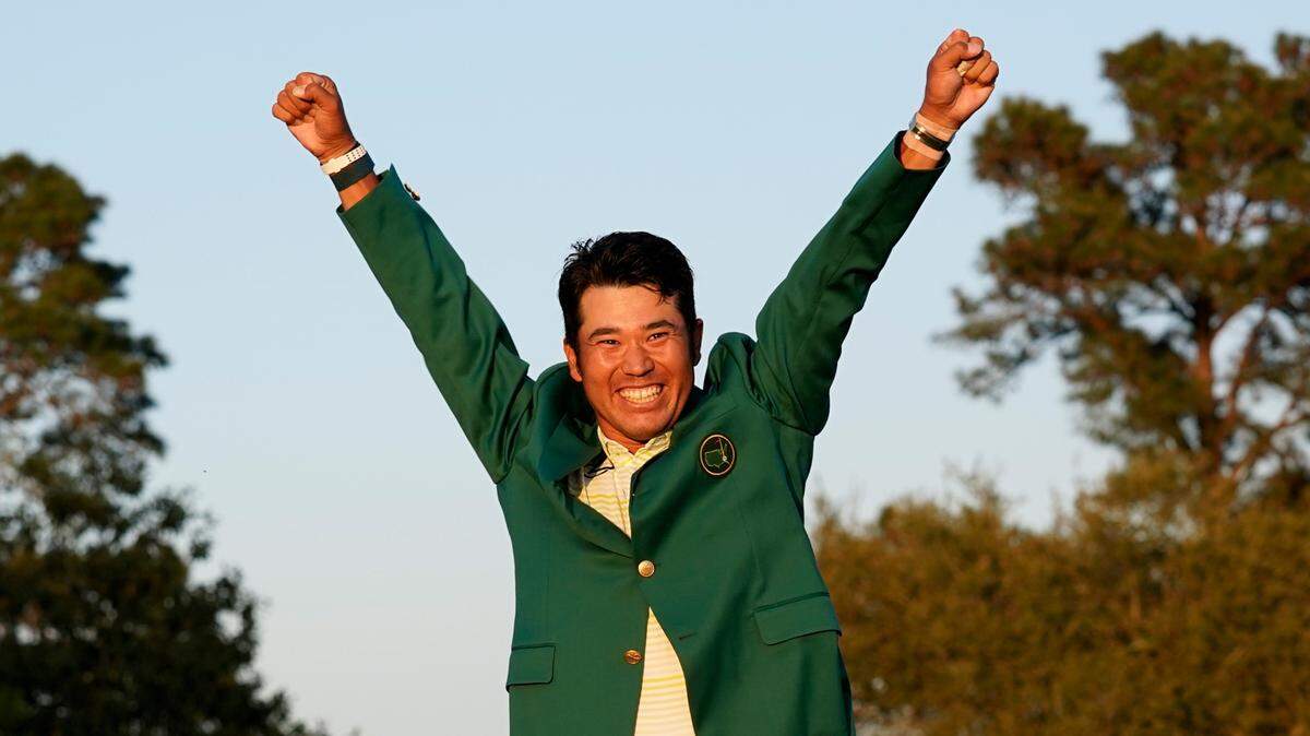 Hideki Matsuyama, of Japan, celebrates after putting on the champion’s green jacket after winning the Masters golf tournament on Sunday, April 11, 2021, in Augusta, Ga. (AP Photo/Gregory Bull)