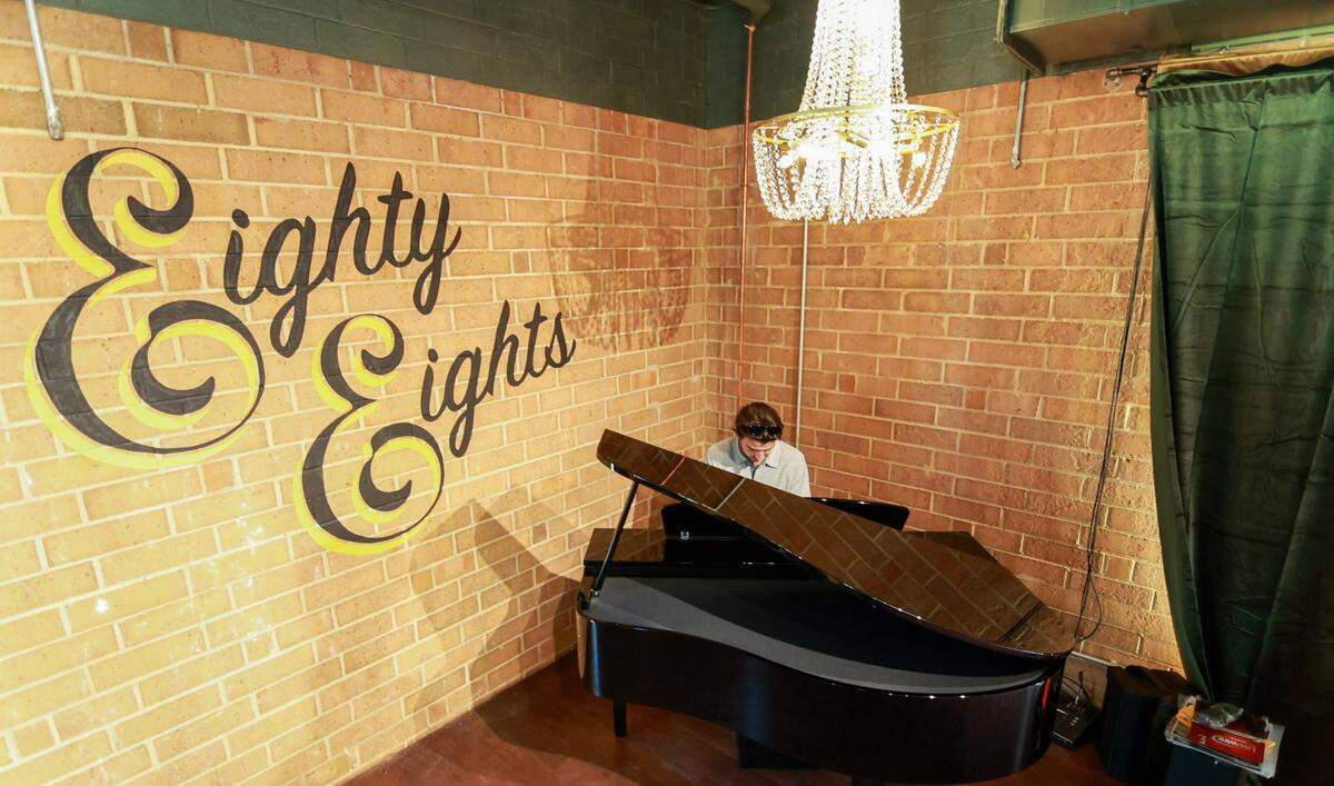 General Manager Ben Mignogna plays the piano at Eighty Eights. The name comes from the fact that there are 88 keys on a piano.