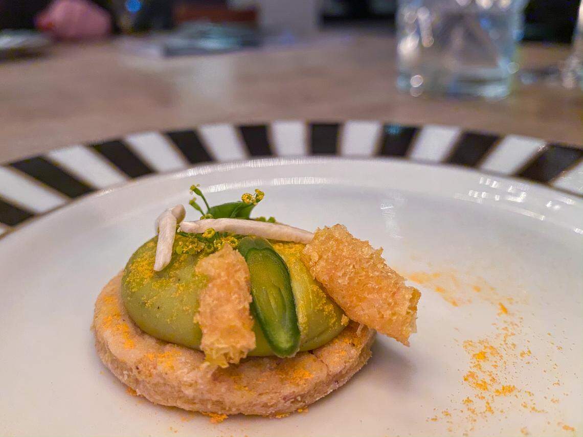 Funyun Tart Shell, Green Bean Mousse, Cheddar Powder, Pickled Mushroom, Haricot Verts and Dill Flower at a recent Anomaly pop-up dinner.