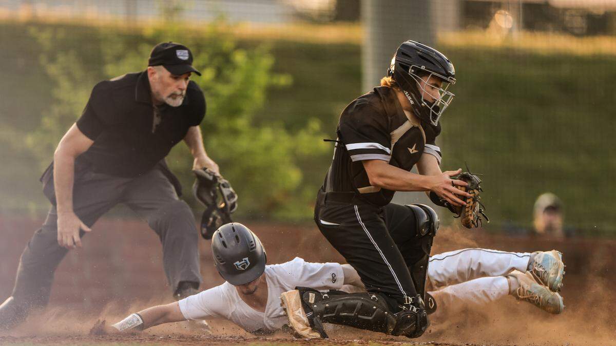 Hopewell’s Tyler Howe slides into home against Hough at Hopewell High School in Huntersville, N.C., on Friday, April 29, 2022.