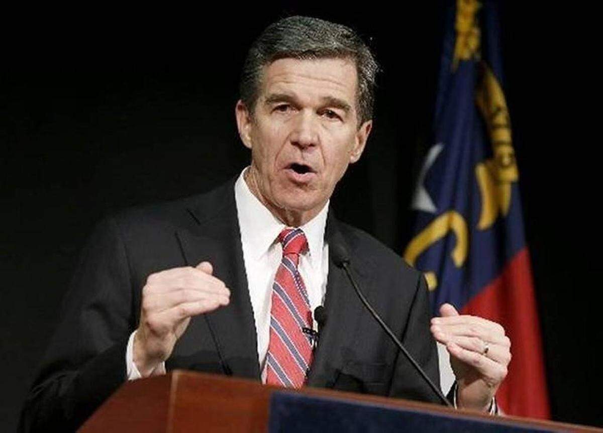 N.C. Gov. Roy Cooper, who says his administration hopes to eventually cancel a toll lane contract with Cintra on I-77 but for now is planning to negotiate improvements such as caps on tolls.